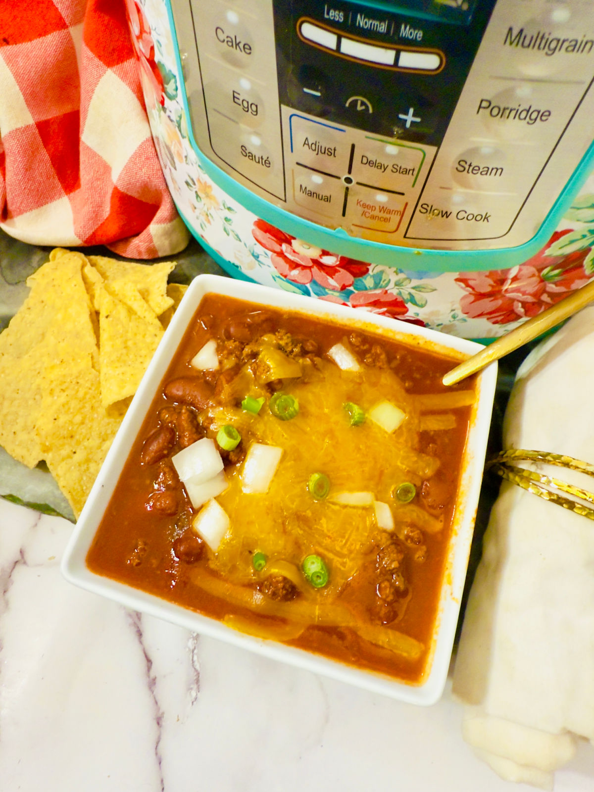 cooked turkey chili with cheese and onions