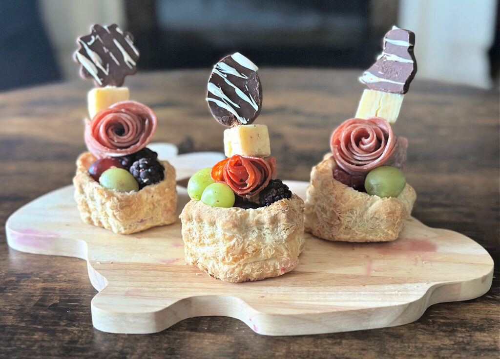 individual charcuterie cups on bunny board