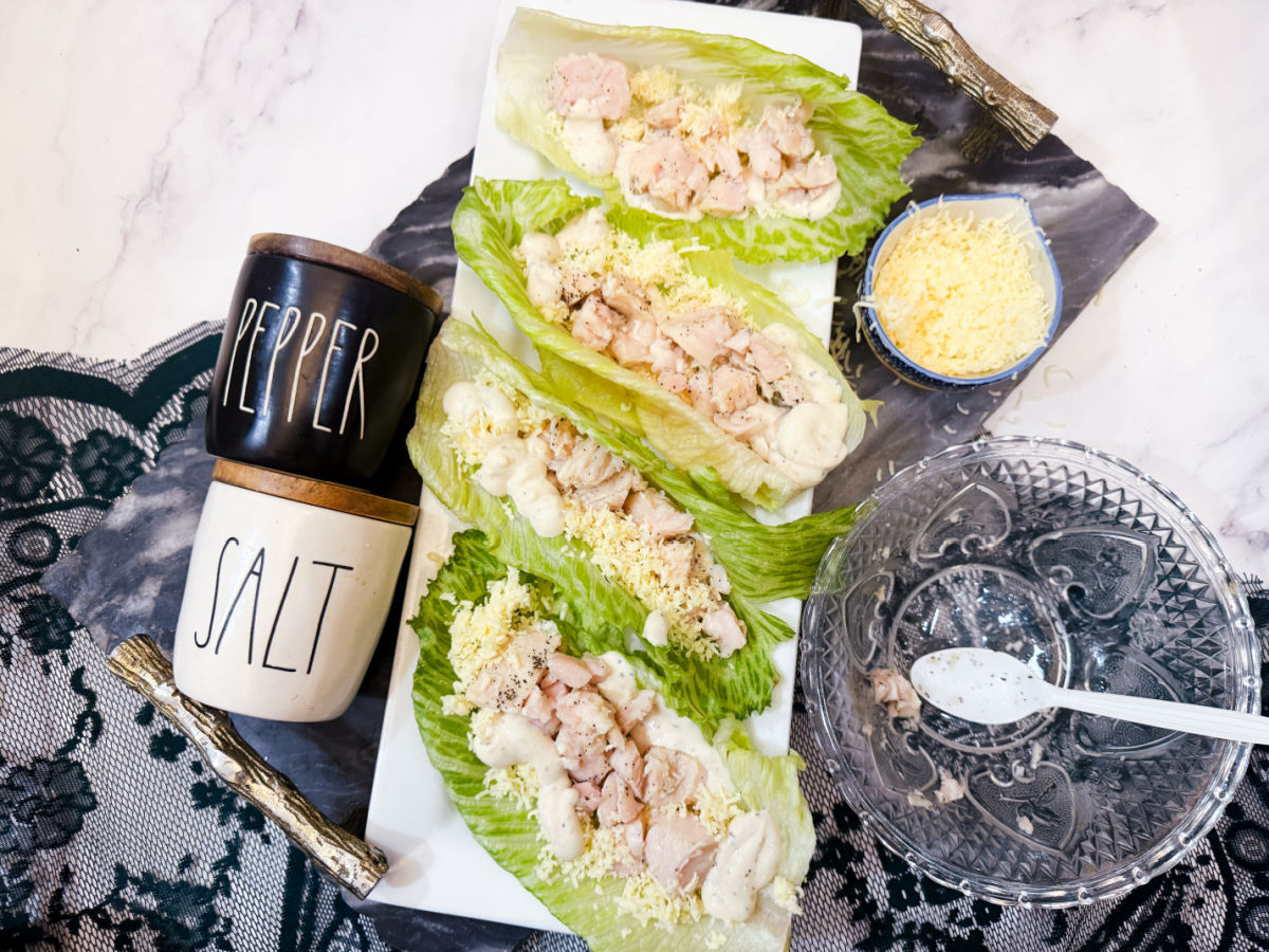 add chicken to lettuce boats