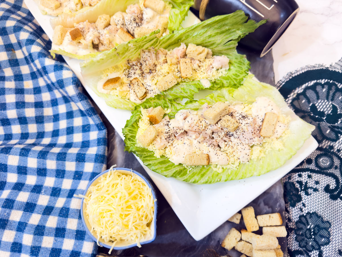 adding dressing to lettuce boats