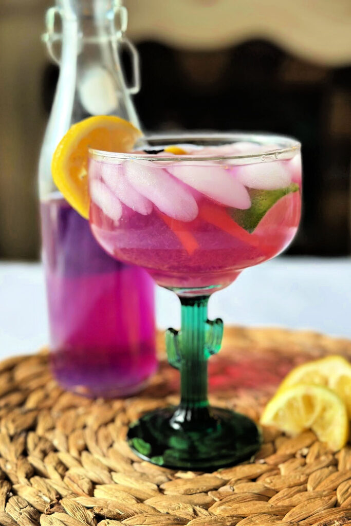 vertical image with purple margarita and simple syrup