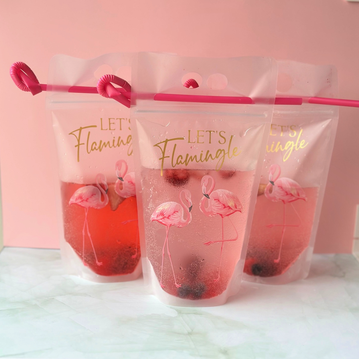 3 adult drink pouches with pink straws