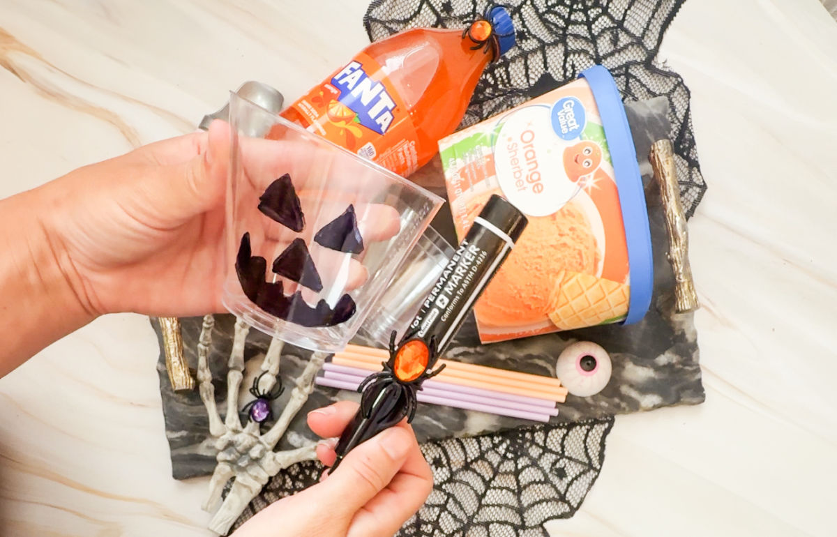 drawing jack o lantern on plastic cup