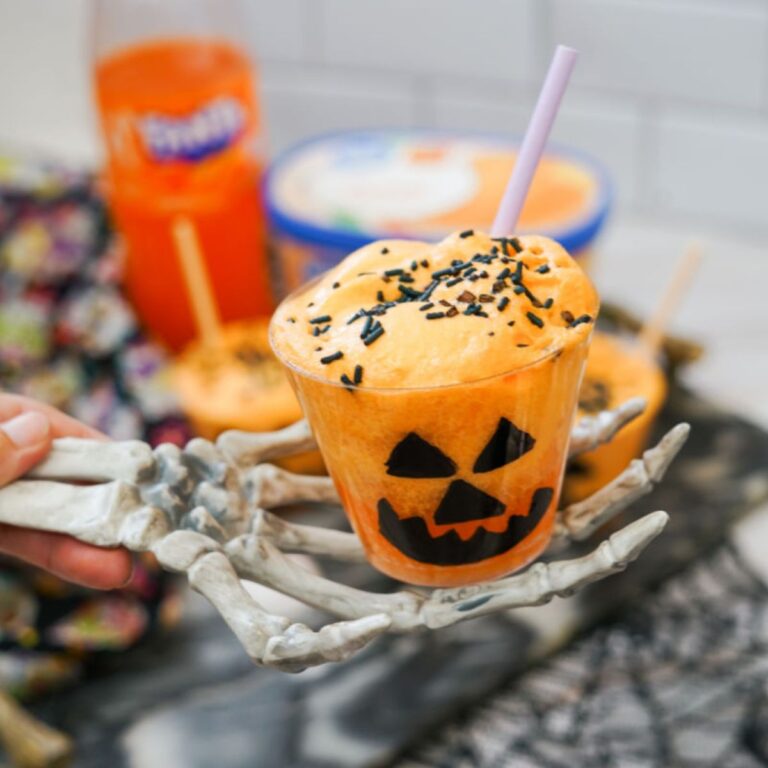 close up of jack o'lantern float with skeleton hand
