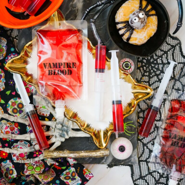 Halloween Jello Shot Syringes with black lace background