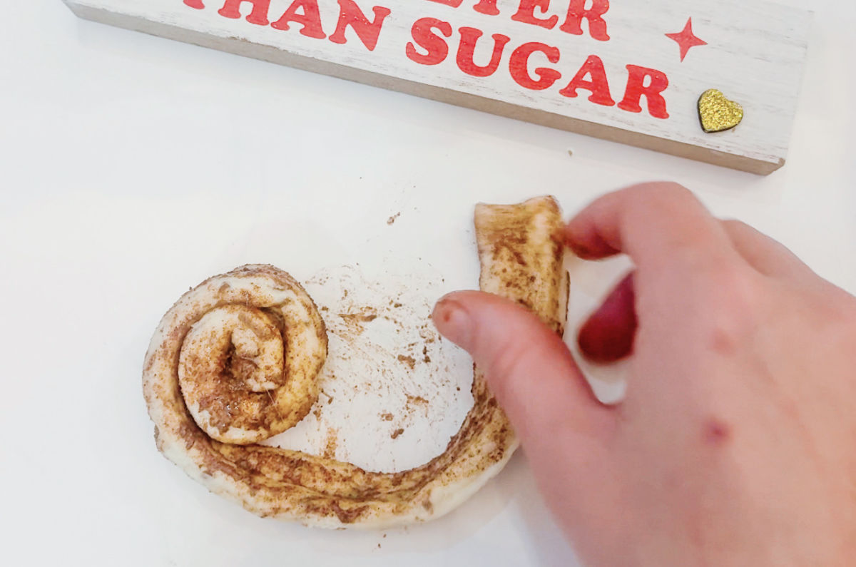 unrolling cinnamon rolls