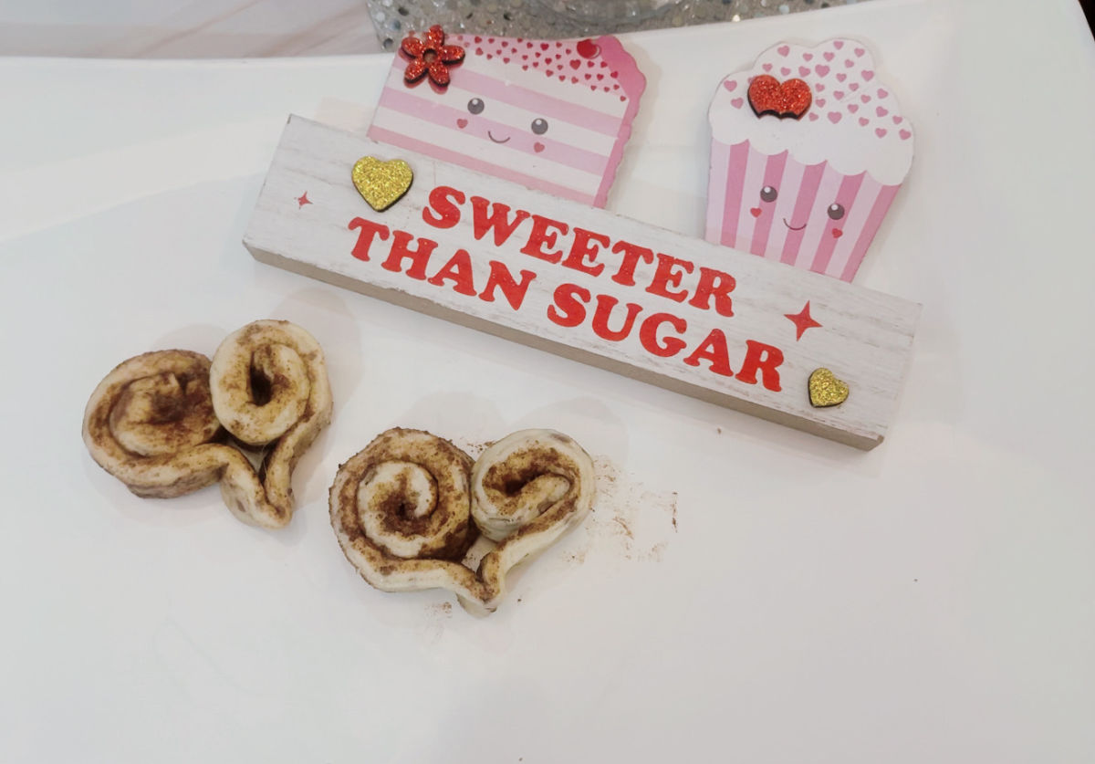 rolling cinnamon rolls into hearts